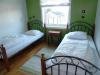 Eines der zwei Schlafzimmer mit jeweils 2 Einzelbetten  in  der Wohnung Beate-1-Obergeschoß
